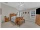 Bright main bedroom featuring a vaulted ceiling and classic wood furniture at 12227 Orchardgrass Ln, Raleigh, NC 27614
