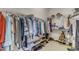 Spacious walk-in closet with ample storage, shelving, and rods for organizing clothes and accessories at 12227 Orchardgrass Ln, Raleigh, NC 27614