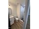Bathroom featuring a walk-in shower with tile surround, modern toilet, and sleek vanity at 1225 Gay St, Rocky Mount, NC 27804