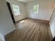 Spacious bedroom with new hardwood floors, fresh paint, and natural light from the many windows at 1225 Gay St, Rocky Mount, NC 27804
