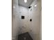 Close-up of the bathroom shower with sleek black fixtures and modern tile surround at 1225 Gay St, Rocky Mount, NC 27804