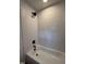 Close-up of the bathroom shower/tub combo with black fixtures and modern tile surround at 1225 Gay St, Rocky Mount, NC 27804