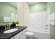 Bathroom features a shower and granite countertop sink at 12309 Aberdeen Chase Way, Durham, NC 27703