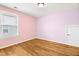 Bedroom with hardwood floors and a bright window at 12309 Aberdeen Chase Way, Durham, NC 27703