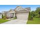 Beautiful home with a two-car garage, lush lawn, and professionally landscaped yard at 12309 Aberdeen Chase Way, Durham, NC 27703