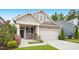 Charming home featuring a Craftsman-style facade, well-manicured lawn, and inviting curb appeal at 12309 Aberdeen Chase Way, Durham, NC 27703