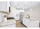 Bright kitchen with white cabinets, granite countertops, and stainless steel appliances at 12309 Aberdeen Chase Way, Durham, NC 27703