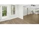 Open floorplan from living room showcasing kitchen and access to backyard at 12309 Aberdeen Chase Way, Durham, NC 27703