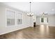 Bright living space with wood flooring, fireplace, and large windows at 12309 Aberdeen Chase Way, Durham, NC 27703