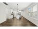 Sun-drenched living area with open floor plan and hardwood floors at 12309 Aberdeen Chase Way, Durham, NC 27703