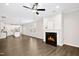 Open concept living area featuring a fireplace and view of the kitchen at 12309 Aberdeen Chase Way, Durham, NC 27703
