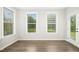 Bright sunroom with lots of natural light and a door to the yard at 12309 Aberdeen Chase Way, Durham, NC 27703