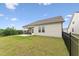 A fenced backyard with a screened in porch and a small patio at 1625 Plover Cir, Fuquay Varina, NC 27526