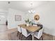 Cozy dining area features a wooden table, comfortable seating, decorative accents, and a stylish light fixture at 1625 Plover Cir, Fuquay Varina, NC 27526
