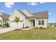 Beautifully landscaped home features a charming front yard and attached two-car garage at 1625 Plover Cir, Fuquay Varina, NC 27526