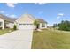 Charming single-Gathering home with a two-car garage and well-manicured lawn at 1625 Plover Cir, Fuquay Varina, NC 27526