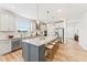 Spacious kitchen features a large island with seating and stainless steel appliances at 1625 Plover Cir, Fuquay Varina, NC 27526