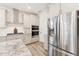 Modern kitchen featuring stainless steel appliances, stylish backsplash, and ample storage at 1625 Plover Cir, Fuquay Varina, NC 27526