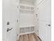 Mudroom with a built-in bench, cubbies, and hooks for organization at 1625 Plover Cir, Fuquay Varina, NC 27526