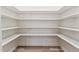 Walk-in pantry with ample shelving for storage at 1625 Plover Cir, Fuquay Varina, NC 27526