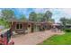Spacious backyard with a paved patio, grill, outdoor seating and landscaped surroundings at 1815 Hawthorne Ln, Burlington, NC 27215