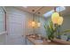 Inviting bathroom with unique lighting, skylight, and granite countertop for a touch of luxury at 1815 Hawthorne Ln, Burlington, NC 27215