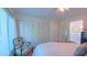Bedroom featuring closet space, window, ensuite bathroom access, and decorative chair at 1815 Hawthorne Ln, Burlington, NC 27215