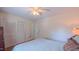 Comfortable bedroom with closet space, ceiling fan, and an ensuite bathroom at 1815 Hawthorne Ln, Burlington, NC 27215