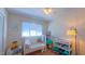 Bright Bedroom with a crib, changing table, and plenty of space for playtime and storage at 1815 Hawthorne Ln, Burlington, NC 27215