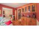 Cozy dining room with adjacent cabinets and access to the living room and kitchen at 1815 Hawthorne Ln, Burlington, NC 27215
