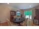 Bright dining room features hardwood floors, traditional furniture and access to the outdoors at 1815 Hawthorne Ln, Burlington, NC 27215