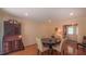 Bright dining room featuring hardwood floors and stylish furnishings is well-lit at 1815 Hawthorne Ln, Burlington, NC 27215