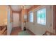 Inviting entryway shows the decorative front doors, adjacent closet and stylish furnishings at 1815 Hawthorne Ln, Burlington, NC 27215