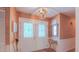 Welcoming entryway boasts decorative glass doors, stylish light fixture and elegant decor at 1815 Hawthorne Ln, Burlington, NC 27215