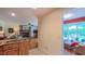 View from the kitchen into the living room and sunroom at 1815 Hawthorne Ln, Burlington, NC 27215