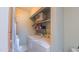 Functional laundry room with washer, dryer, and storage shelf offers convenience at 1815 Hawthorne Ln, Burlington, NC 27215
