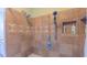Elegant tiled shower with dual shower heads, niche, and hand-held sprayer for a spa-like experience at 1815 Hawthorne Ln, Burlington, NC 27215