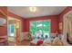 Cozy sunroom with a large window showcasing the backyard at 1815 Hawthorne Ln, Burlington, NC 27215