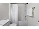 Bright bathroom featuring a shower with white curtain and a towel rack at 1851 Trailwood Heights Ln, Raleigh, NC 27603