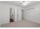 This carpeted bedroom includes ample closet space and an en-suite bathroom at 1851 Trailwood Heights Ln, Raleigh, NC 27603