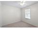 Cozy bedroom with a ceiling fan, neutral carpet, and bright window at 1851 Trailwood Heights Ln, Raleigh, NC 27603