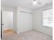 Neutral bedroom featuring a large closet, a window and carpet flooring at 1851 Trailwood Heights Ln, Raleigh, NC 27603