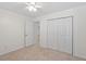 Bedroom featuring neutral carpet, a ceiling fan, and closet at 1851 Trailwood Heights Ln, Raleigh, NC 27603