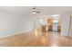 Bright open-concept living area featuring a well-equipped kitchen with modern appliances and a breakfast bar at 1851 Trailwood Heights Ln, Raleigh, NC 27603