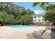 Community pool with lounge chairs and a blue sky at 1851 Trailwood Heights Ln, Raleigh, NC 27603