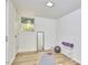 Bright basement featuring hardwood floors, a mirror, and exercise equipment at 19 Learned Pl, Durham, NC 27705