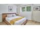 Cozy bedroom with a wooden platform bed, modern decor, and a serene atmosphere at 19 Learned Pl, Durham, NC 27705