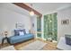 Comfortable bedroom with a daybed, featuring large windows that offer stunning views of the outdoors at 19 Learned Pl, Durham, NC 27705