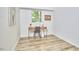 Bright bedroom featuring hardwood floors, a modern desk, a chair, and a window with a view of the trees at 19 Learned Pl, Durham, NC 27705