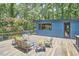 Outdoor deck featuring modern furniture and surrounded by lush greenery at 19 Learned Pl, Durham, NC 27705
